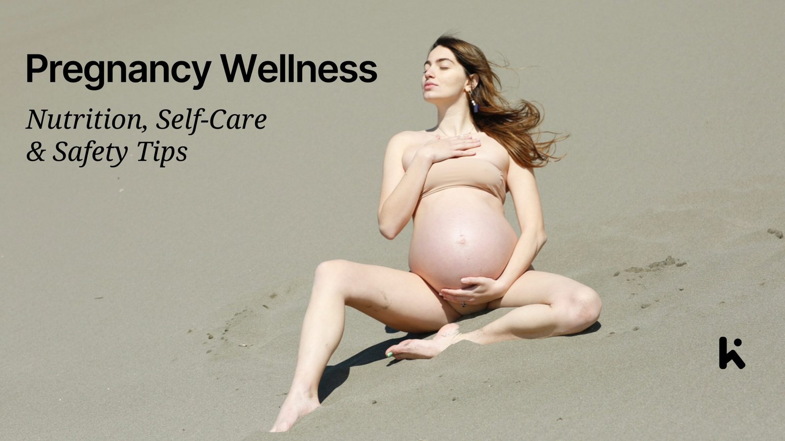 Pregnant woman sitting on sand with a serene expression, embracing her belly, symbolizing pregnancy wellness, self-care, and natural beauty.